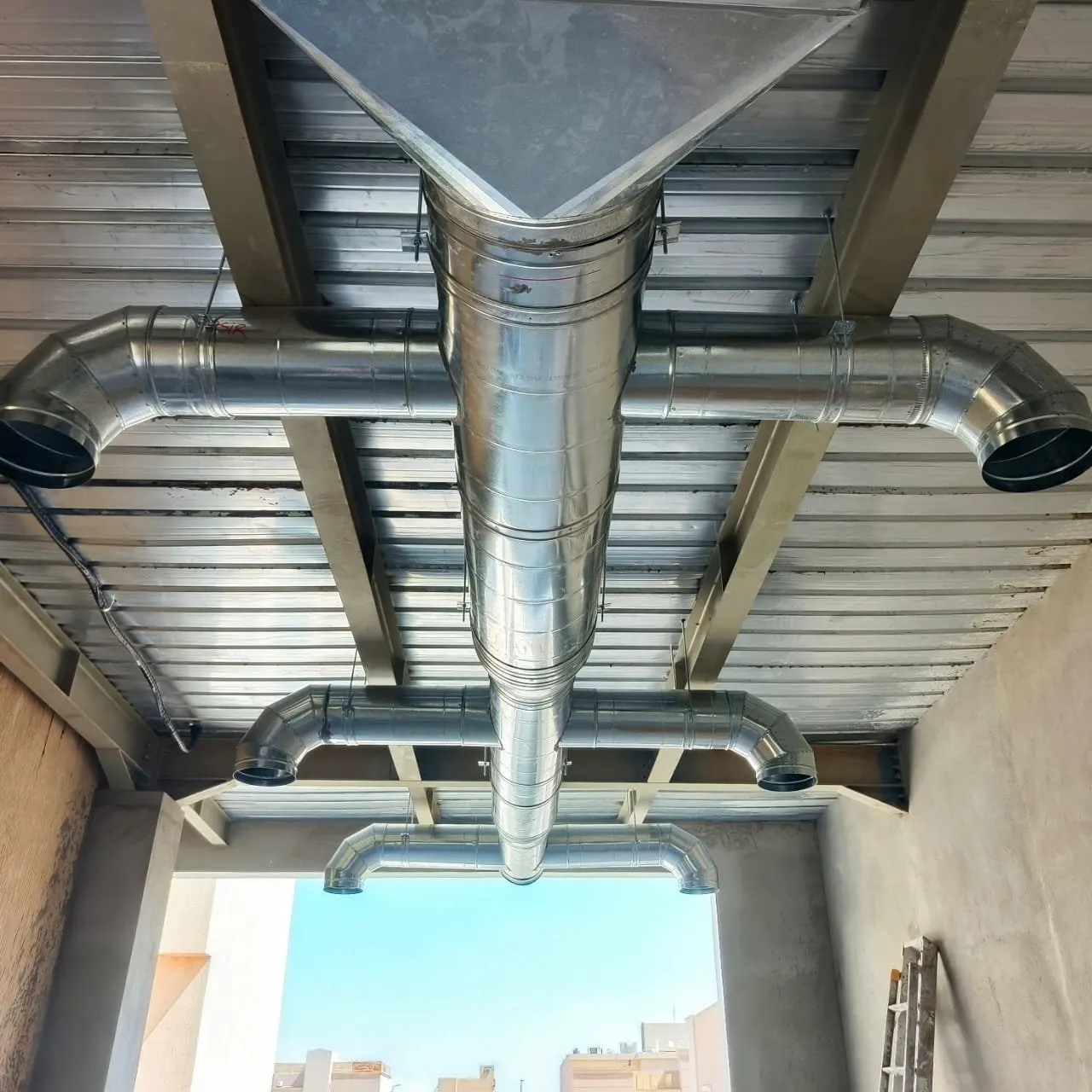 Insulated and ventilated ductwork running through a building shaft